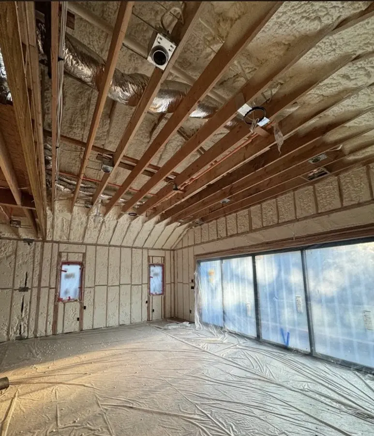 Interior walls and ceiling insulated with spray foam during new construction in Archer Lodge